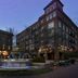 Hampton Inn Huntsville/Village of Providence in Huntsville with courtyard fountain and brick buildings