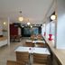 Hotel Göingehof in Hässleholm dining room with long tables, pendant lights and wall map