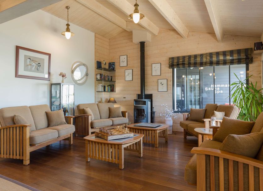 Les Vignes de la Chapelle in Sainte-Marie-de-Ré lounge with sofas, armchairs, coffee tables and wood stove