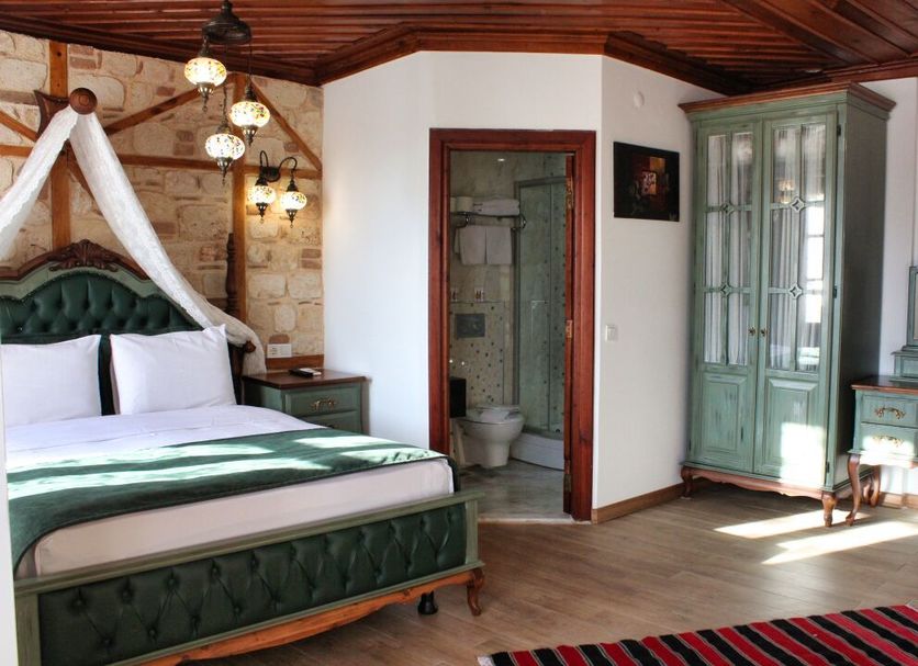 White Garden Hotel-Adult Only, Antalya room with canopy bed, vintage wardrobe and bathroom doorway