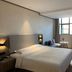 Hanting Hotel Dongguan Changan Wanda room with bed, sofa, desk and window in Dongguan