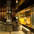 Quentin Boutique Hotel Berlin lobby lounge with sofa seating and floor-to-ceiling street view