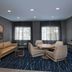 Fairfield by Marriott Inn & Suites Kansas City Airport lounge with seating area and windows in Kansas City