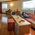 ibis Antananarivo Ankorondrano room with wood floors, sofa, desk and city-view windows in Antananarivo
