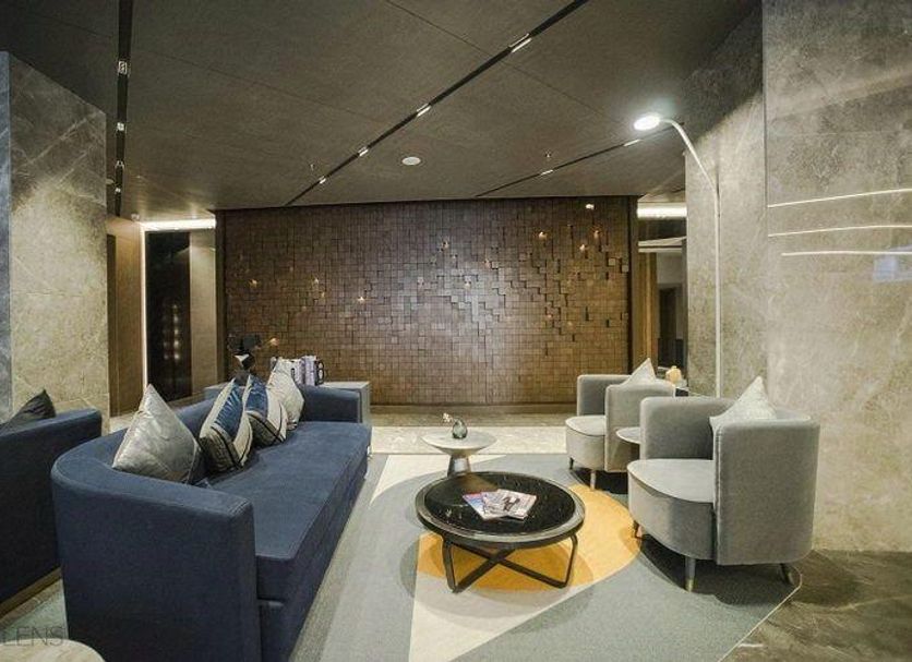 Ai Fei Hotel (Shanghai Xintiandi Lujiabang Road Metro Station) lounge with sofa seating and round tables in Shanghai