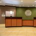 Fairfield Inn & Suites by Marriott Lewisburg lobby with two front desks and decorative wall art