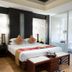Palette Bangkok Natural Resort and Spa in Bangkok guest room with king bed and adjoining bath area