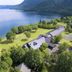 Towada Prince Hotel in Kosaka with lakefront views, green lawns, and forested mountains