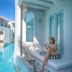 Resort De Paskani in Hua Hin with a poolside villa terrace and a woman seated by the water