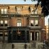 Hotel Belvedere in Kingston, brick hotel facade with arched windows and front steps at dusk