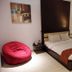 Sanghyang Indah Spa resort in Anyar guest room with bed, beanbag chair and desk