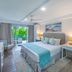 Blue Haven Holiday Apartments in Christchurch bedroom with balcony view, desk and twin nightstands
