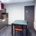Wellness Apart Hotel Brussels kitchenette with table, sink, stove and chair in a guest room