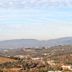 Villa Ambrosina in Impruneta with panoramic hillside and valley views under a cloudy sky