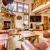 Eagleridge Lodge & Townhomes in Steamboat Springs living room with stone fireplace and loft seating