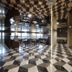 Aventree Hotel Busan lobby with checkered floor, mirrored ceiling, and city view windows