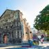 Guijo Suites Makati in Makati, historic stone church exterior near the hotel