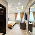Side One Design Hotel Garni in Belgrade guest room with double bed, wall TV, mirror and bathroom door