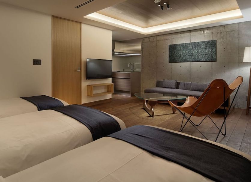 22 Pieces Kyoto guest room with twin beds, sofa seating and kitchenette area