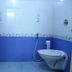 Misty Green Homestay Thekkady bathroom with wall-mounted toilet and shower