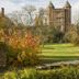 London Beach Country Hotel & Golf Club in Tenterden, historic brick tower beside landscaped gardens