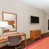 Baymont by Wyndham Savannah/Garden City Savannah room with two beds, desk, TV and dresser