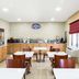 Baymont by Wyndham Savannah/Garden City breakfast room with tables, chairs, and buffet stations in Savannah