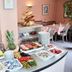 Hotel Garni Niedernhausen breakfast buffet with fruit, pastries, cold cuts and coffee service