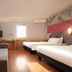 ibis Beijing Dongdaqiao room with two twin beds, sofa, desk and window in Beijing