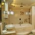 Hotel Amar Vilas, Indore bathroom with bathtub, glass shower partition, vessel sink and toilet