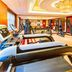 Hulunbeier Hotel in Hulunbuir fitness center with treadmills, weight machines and ornate ceiling