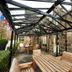 Loch Kinord Hotel in Aboyne with a covered stone patio and wooden outdoor seating