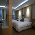 Benikea Hotel Yeosu guest room with ocean view and twin beds in Yeosu