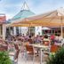 Hotel Schmelmer Hof in Bad Aibling outdoor terrace with dining tables and guests