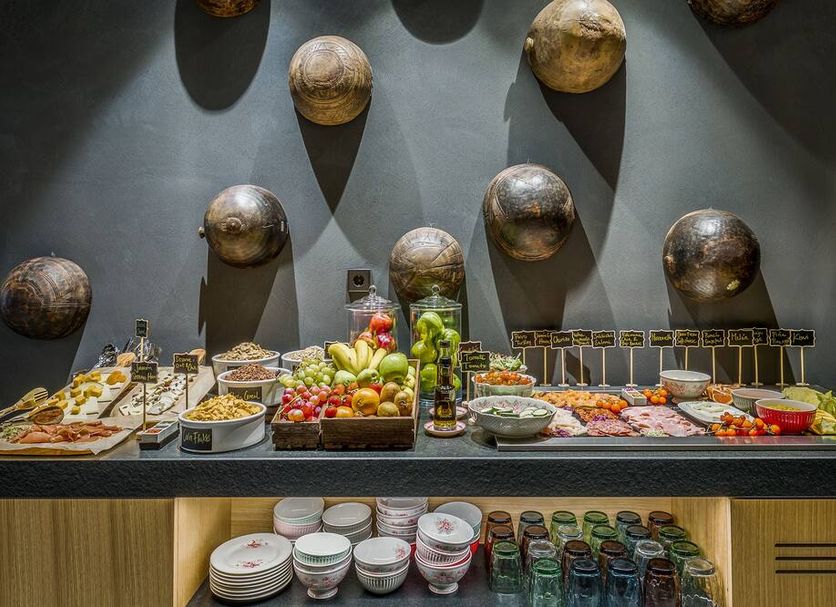 Room Mate Collection Gerard Barcelona breakfast buffet with fruit, pastries, yogurt and cereals