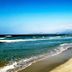Beach and turquoise sea view from Zafiro Alzinar Mar in Can Picafort, with sandy shoreline and distant coast