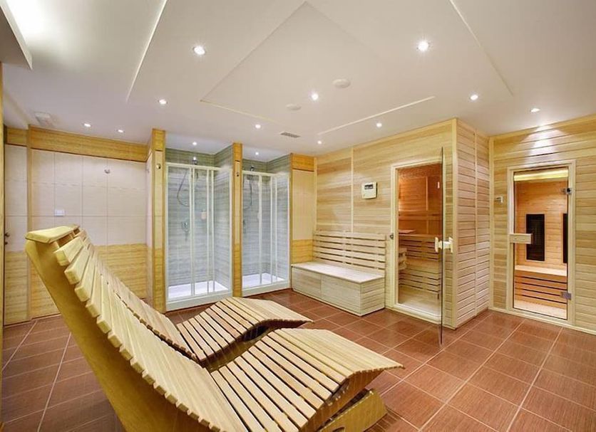 Zlata Hvezda in Třeboň spa area with wooden loungers, tiled floor, and sauna rooms