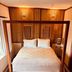 Boutique Hotel Casa Teatro in Manaus guest room with four-poster bed and colorful stools