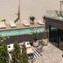 Krista Boutique Hotel Buenos Aires rooftop pool with loungers, glass railing and terrace seating