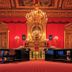 Parkhotel Luise in Bad Herrenalb: ornate red ballroom with chandelier and gilded details