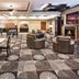 Holiday Inn Express & Suites Jacksonville lobby with seating area, breakfast bar and fireplace
