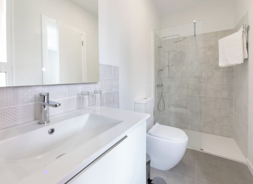 Hotel Boutique Hc Maga bathroom with walk-in shower, wall-mounted toilet and sink in Puerto de la Cruz