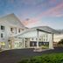 Fairfield Inn & Suites by Marriott Harrisburg Hershey exterior with covered entrance at dusk
