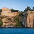 Grand Hotel Ambasciatori in Sorrento perched on a cliff above the sea with rocky coastline