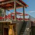 Ossanzaia Bilene Lodge in Bilene with a rooftop terrace, red seating, and outdoor stairs