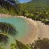 Mai Pen Rai Bungalows in Ko Pha Ngan with a secluded tropical beach, turquoise water and lush hills