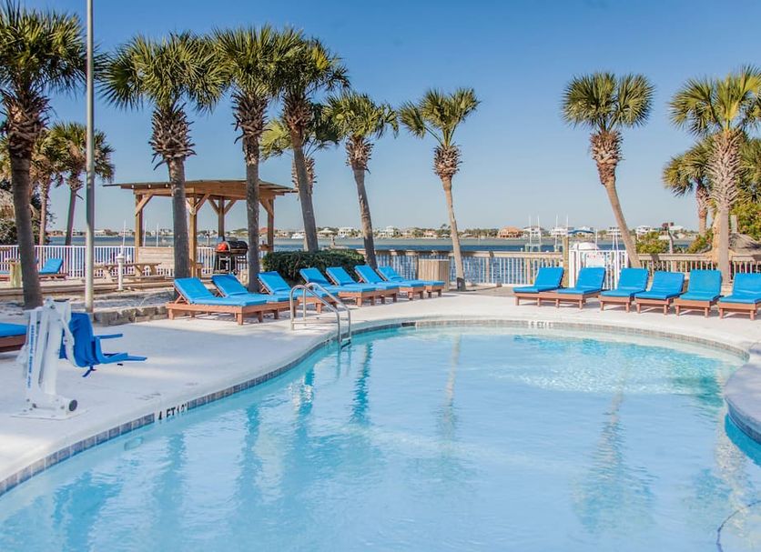 Surf & Sand Hotel in Pensacola Beach with palm-lined pool and Gulf view