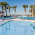 Surf & Sand Hotel in Pensacola Beach with palm-lined pool and Gulf view