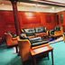 Jinshan Hotel Shanghai lounge with green carpet, leather sofas, and wood-paneled walls