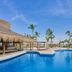 Fiesta Americana Cancun Villas in Cancún with palm-lined pool and beachside view